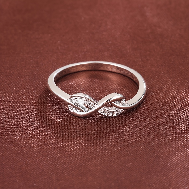 Golden Tone Infinity Symbol Ring with Zirconia Stones